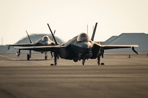 Two U.S. Air Force F-35A Lightning IIs from the 421st Expeditionary Fighter Squadron taxi on the runway