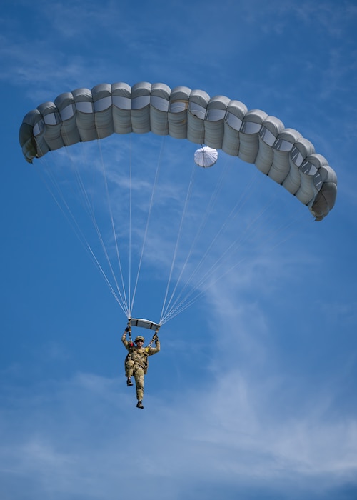 A U.S. Air Force pararescueman executes a precision parachute landing at Freeman Municipal Airport in Seymour, Ind., Sept. 4, 2023, as part of the 2023 PJ Rodeo. The biennial event, which tests the capabilities of pararescue Airmen across the service, was hosted by the Kentucky Air National Guard’s 123rd Special Tactics Squadron. (U.S. Air National Guard photo by Dale Greer)