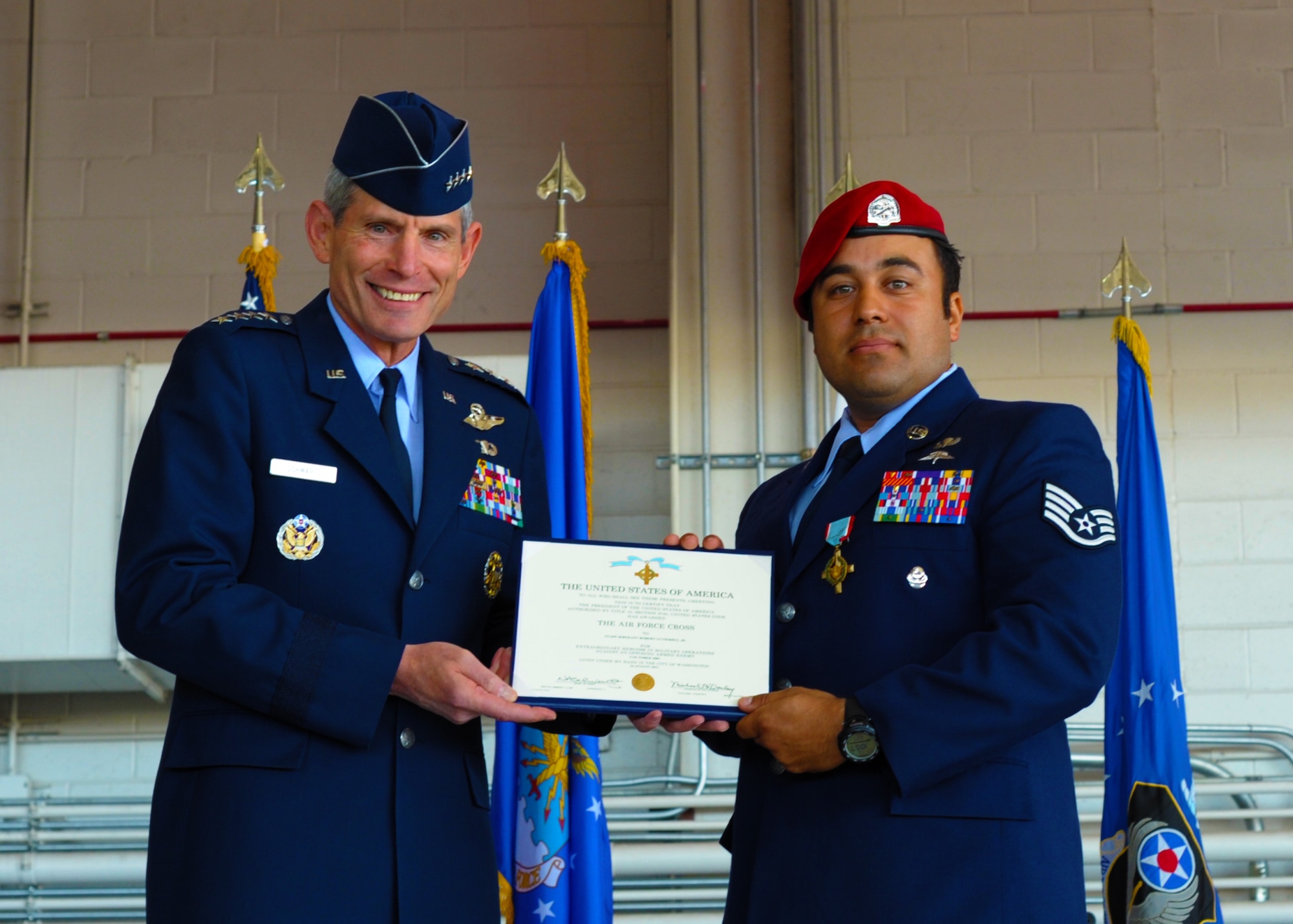 Gen. Norton Schwartz, Chief of Staff of the U.S. Air Force, presents the Air Force Cross to Staff Sgt. Robert Gutierrez