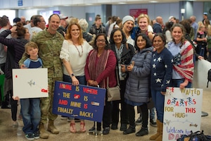 U.S. Air Force Senior Master Sgt. Sanjay Allen, the 2d Audiovisual Squadron superintendent, poses for a photograph with his family at Salt Lake City International Airport, Utah, Feb. 5, 2020. This is the first time his Indian family saw him in his uniform since he left for the Air Force 20 years ago. (U.S. Air Force photo by Staff Sgt. Jarrod M. Vickers)