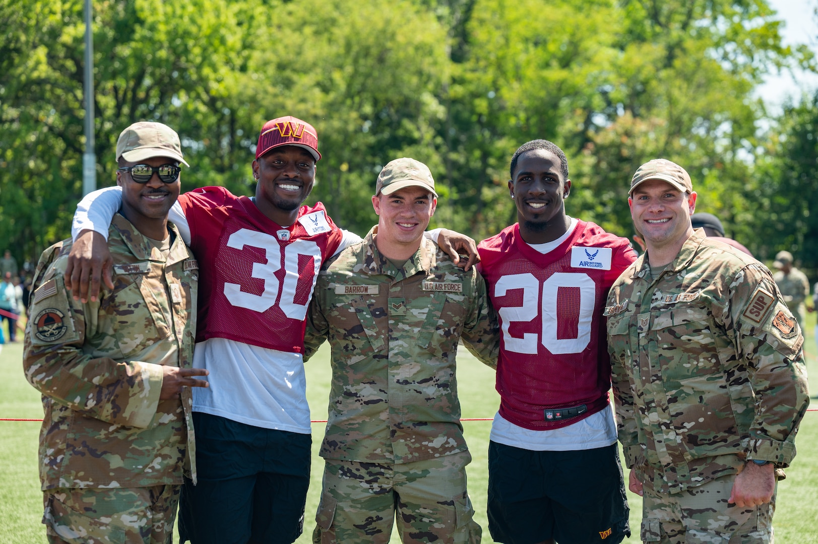 U.S. Air National Guard Airmen assigned to units within the national capital region pose for a photo with Washington Commanders football players during an open practice held at Joint Base Andrews, Maryland, Aug. 25, 2023. As part of a partnership between the Washington Commanders and U.S. Air Force, an Air National Guard patch will be featured on the Commanders defensive players’ practice jerseys this season to help garner exposure for recruiting the next generation of Airmen. (U.S. Air National Guard photo by Tech. Sgt. Sarah M. McClanahan)