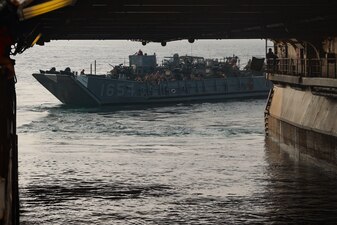 A landing craft utility boat departs the well deck of amphibious assault ship USS Bataan (LHD 5) in the Arabian Gulf, Sept. 5, 2023.