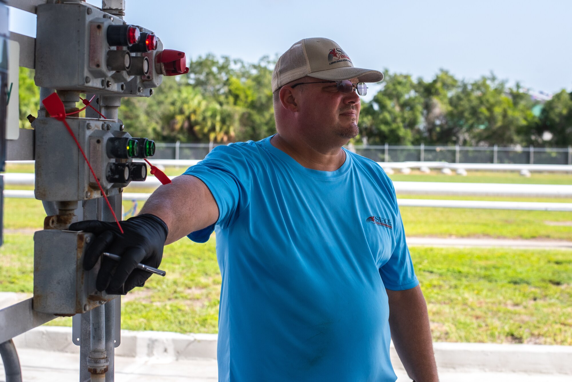 Brian Sutton, SIEGE enterprises fuel distribution system operator, operates the control board at the fuel supply loading station at MacDill Air Force Base, Florida, August 22, 2023.