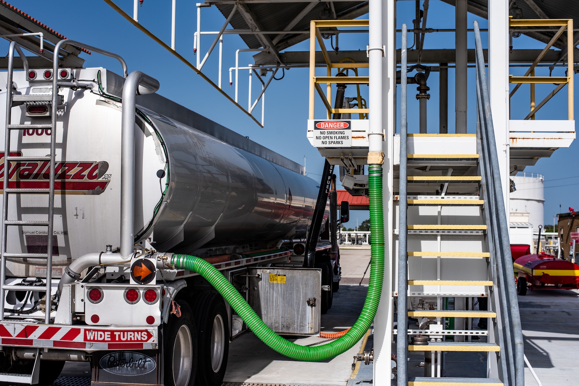 An air vent hose is connected to fuel supply tanker truck at MacDill Air Force Base, Florida, August 22, 2023.