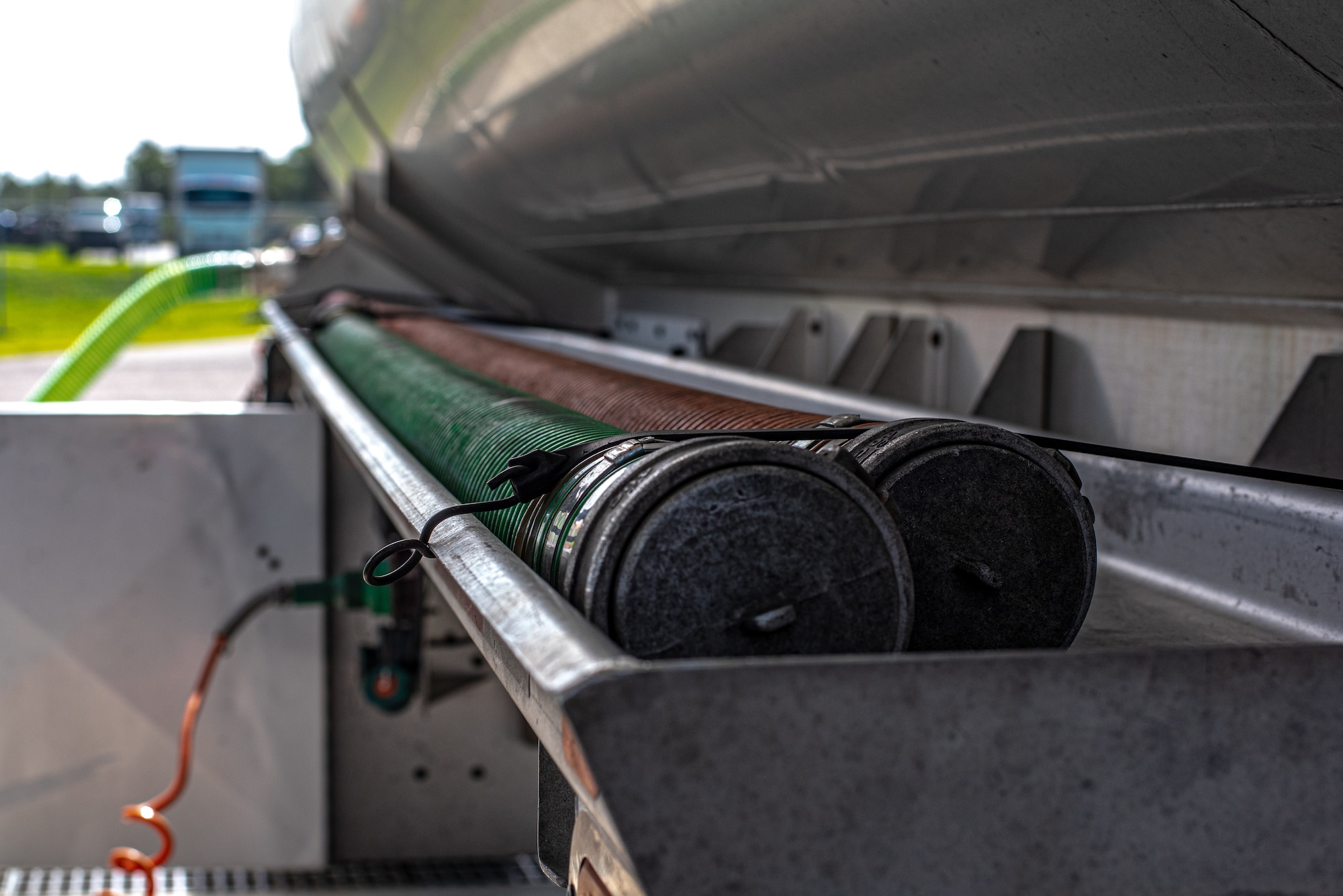 The air vent hose is secured to the tank trailer of fuel supply tanker truck at MacDill Air Force Base, Florida, August 22, 2023.