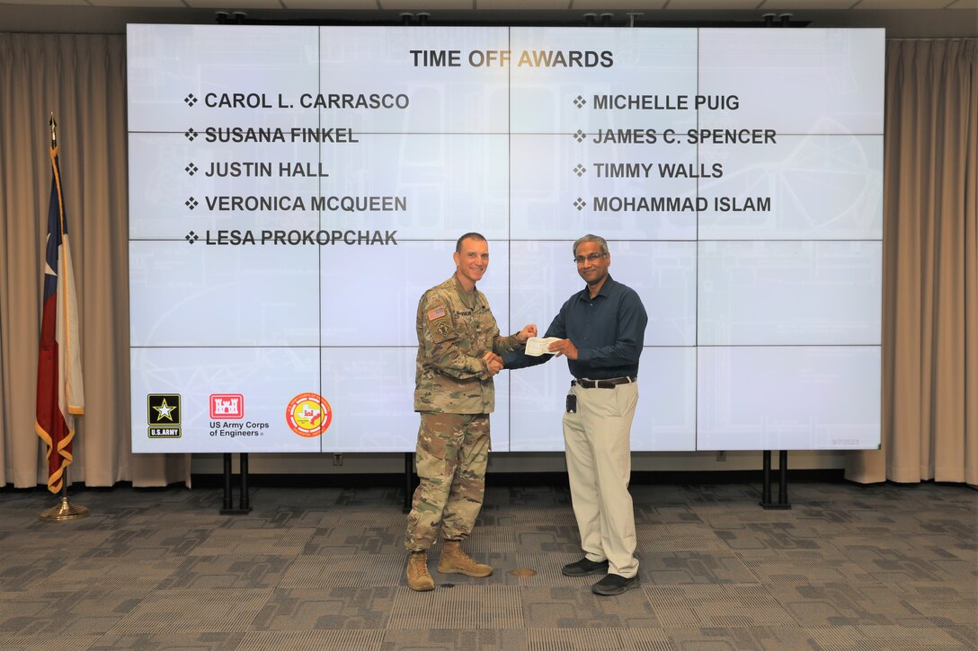 Col. Rhett Blackmon, U.S. Army Corps of Engineers (USACE), Galveston District (SWG) commander, presents Mohammad Islam, Hydrology & Hydraulics Reservoir Control Branch, civil engineer (Hydraulics), with a time off award during the SWG Fiscal Year 2023, 4th Quarter Army Professional Awards Ceremony and Townhall at the Jadwin Building in Galveston, Texas, Sept. 7, 2023.