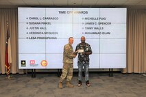 Walls received his time off award for volunteering with the SWG Corps Day recreation committee.