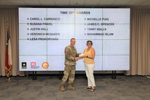 Puig received the time off award for volunteering with the SWG Corps Day recreation committee.