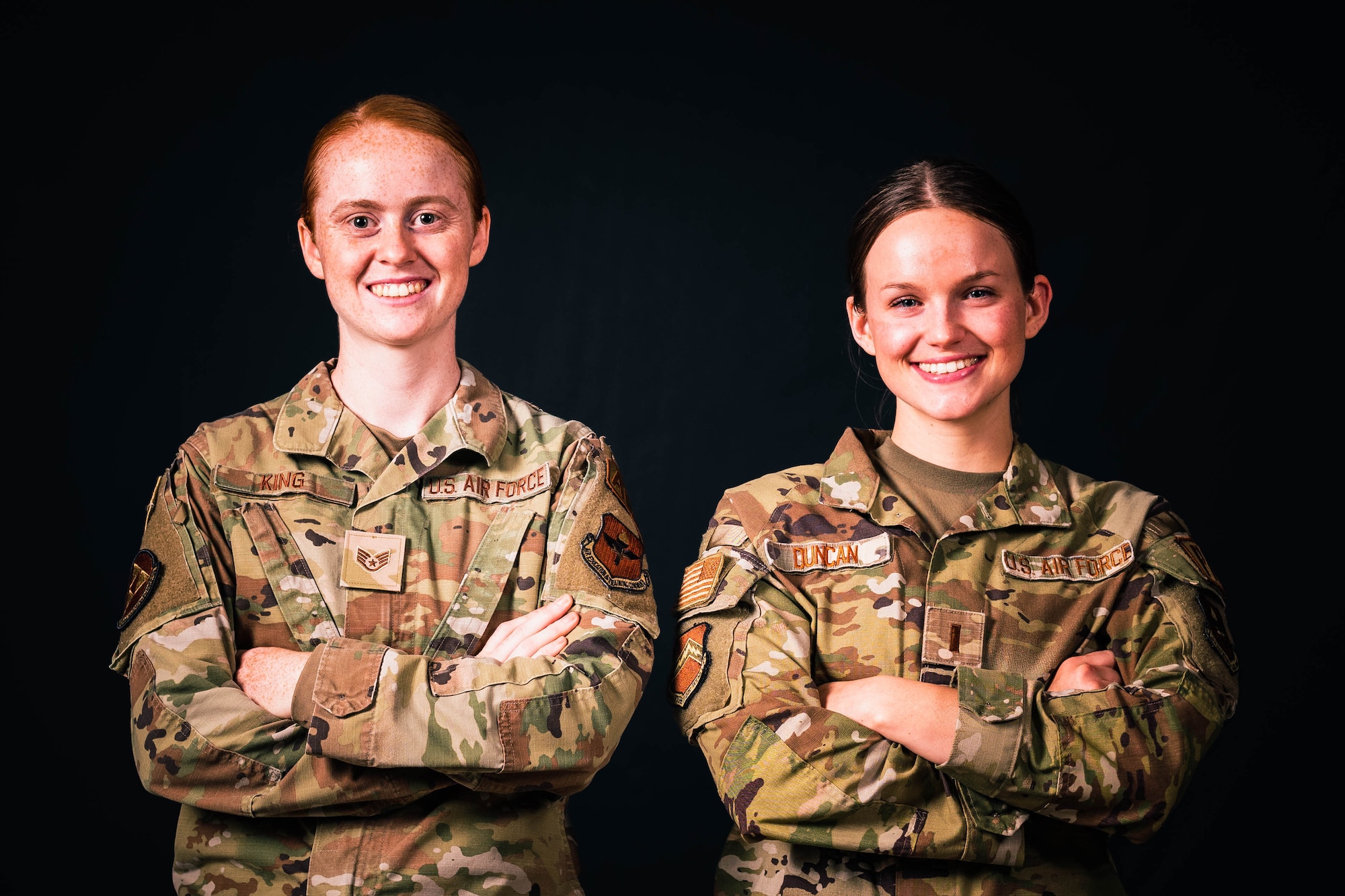 U.S. Air Force Staff Sgt. McKenzie King, 56th Equipment Maintenance Squadron aerospace ground equipment non-commissioned officer and Air Education Training Command’s initiative Torch Athena lead volunteer coordinator (left), 2nd Lt. Abbey Duncan, 56th Fighter Wing public affairs officer (right), pose for a photo for a photo.