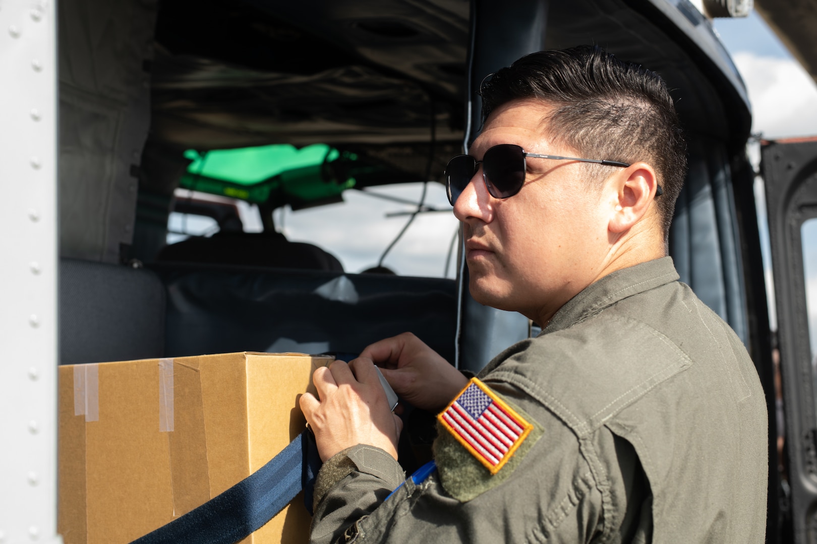 A U.S. Air Force Airman secures simulated humanitarian aid.