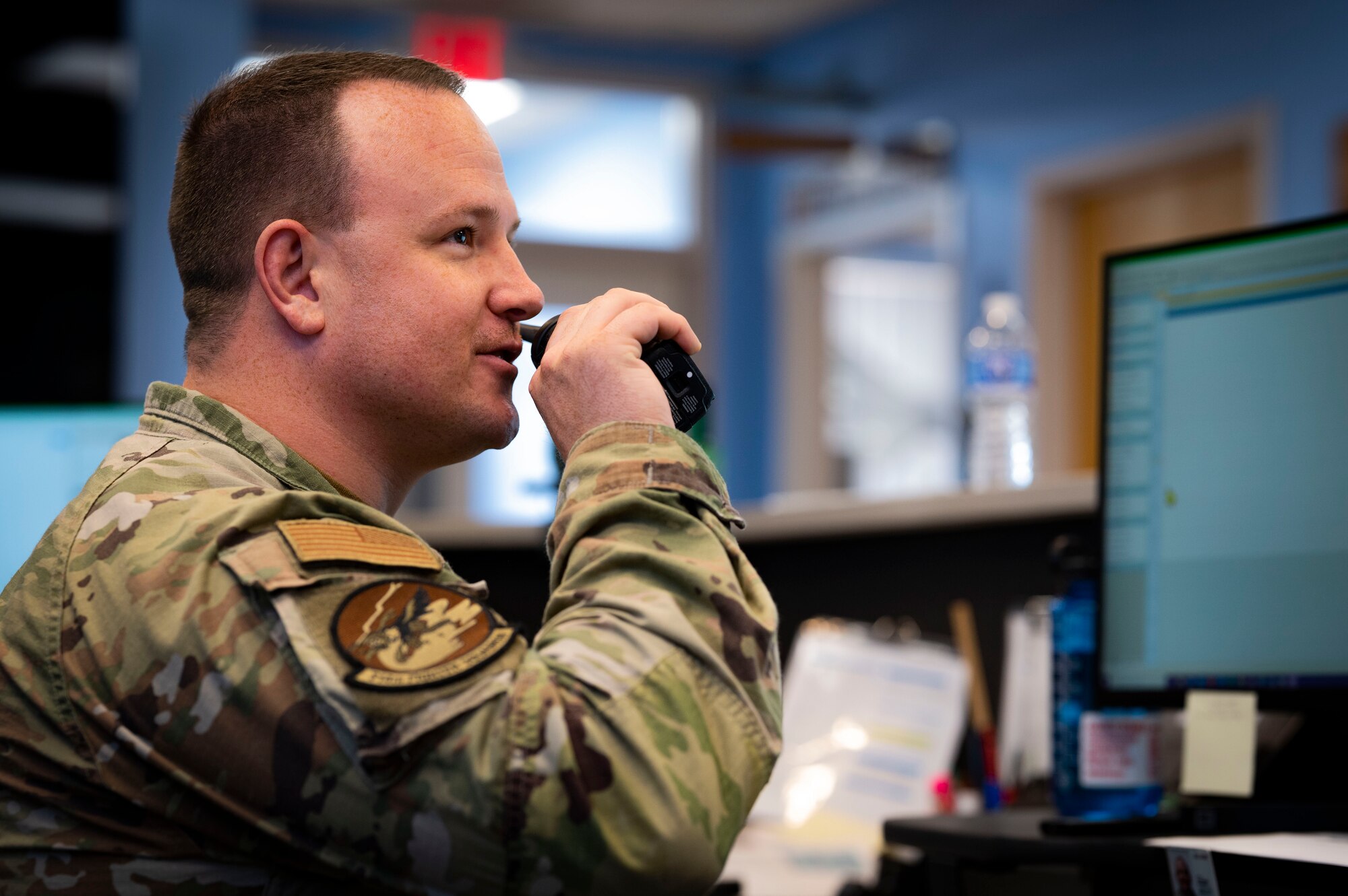 U.S. Air Force Staff. Sgt. Nicholas Clum, 314th Fighter Squadron aviation resource management noncommissioned officer in charge, does a radio check at Holloman Air Force Base, New Mexico, Aug. 29, 2023. Holloman’s SARMs are responsible for managing pilot schedules, aircraft maintenance, and mission coordination, ensuring that no detail is overlooked. (U.S. Air Force photo by Airman 1st Class Isaiah Pedrazzini)