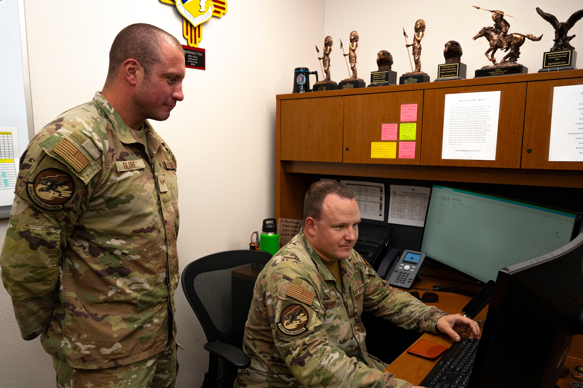 U.S. Air Force Staff. Sgt. Nicholas Clum, 314th Fighter Squadron aviation resource management noncommissioned officer in charge, and Senior Airman Garret Galore, 314th FS aviation resource management journeyman, monitor the daily flight mission data together at Holloman Air Force Base, New Mexico, Aug. 29, 2023. SARMs create each flight plan, ensuring that every flight mission at Holloman is scheduled, equipped, and executed safely. (U.S. Air Force photo by Airman 1st Class Isaiah Pedrazzini)