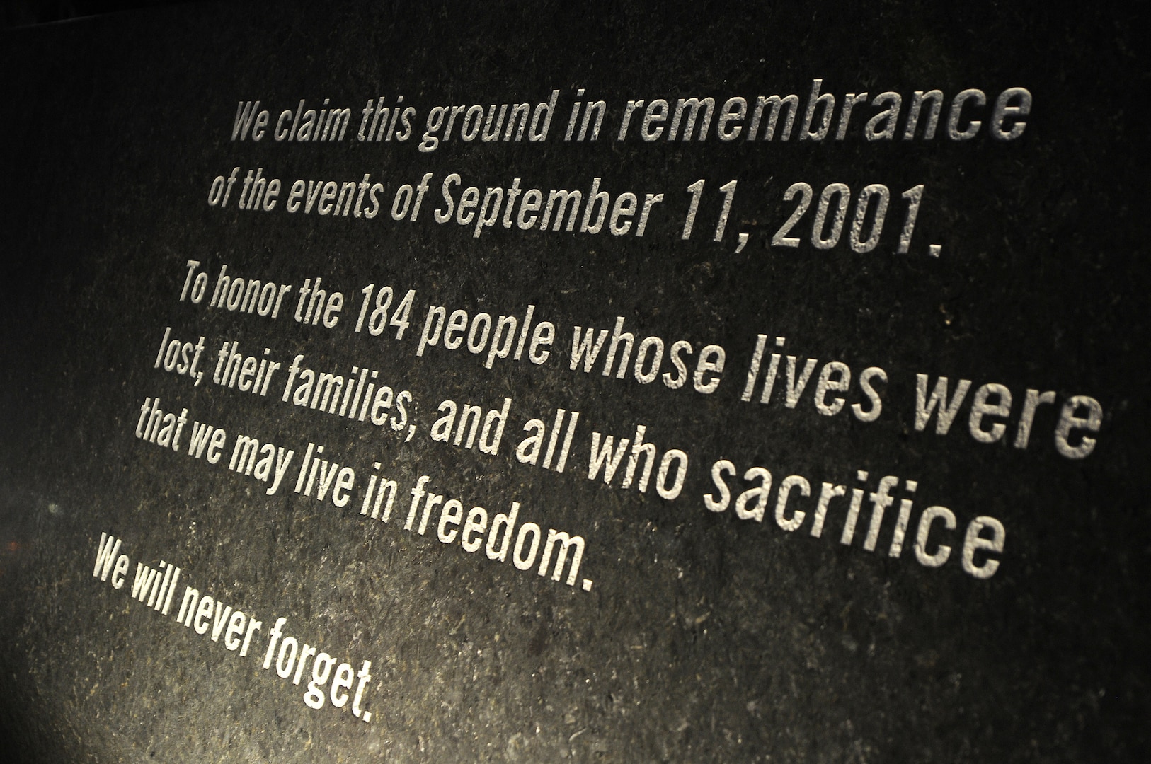 A marker at the National 9/11 Pentagon Memorial serves as a reminder of the 9/11 attack on the Pentagon.