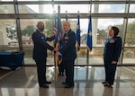 Air Force commander poses with guidon