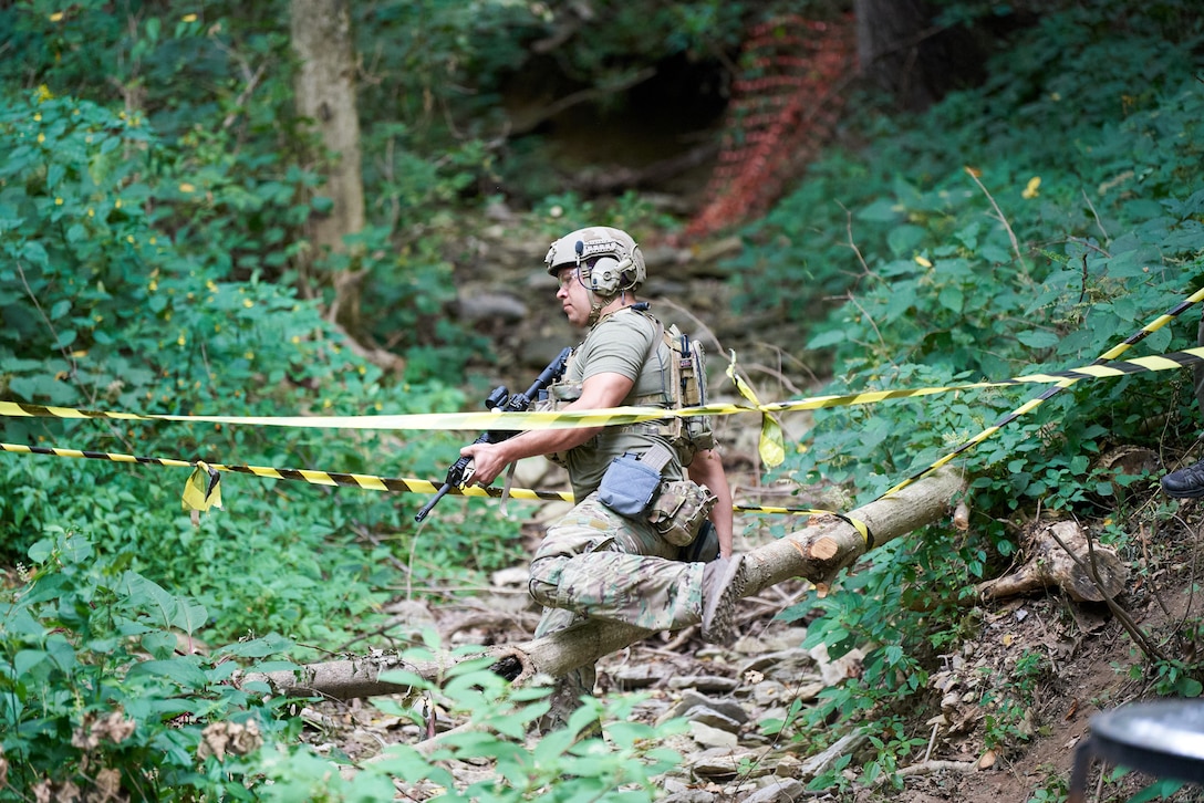 A U.S. Air Force pararescueman navigates a marksmanship course in Elizabeth, Ind., Sept. 5, 2023, as part of the PJ Rodeo. The biennial event, which tests the capabilities of pararescue Airmen across the service, was hosted by the Kentucky Air National Guard’s 123rd Special Tactics Squadron. (U.S. Air National Guard photo by Phil Speck)