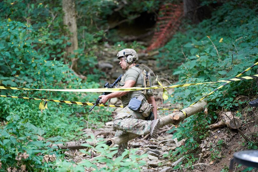 A U.S. Air Force pararescueman navigates a marksmanship course in Elizabeth, Ind., Sept. 5, 2023, as part of the PJ Rodeo. The biennial event, which tests the capabilities of pararescue Airmen across the service, was hosted by the Kentucky Air National Guard’s 123rd Special Tactics Squadron. (U.S. Air National Guard photo by Phil Speck)