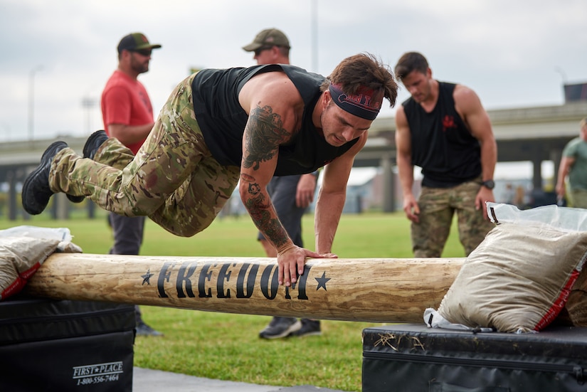 U.S. Air Force pararescuemen compete in a “Monster Mash,” a series of physical and mental challenges, at Waterfront Park in Louisville, Ky., Sept. 7, 2023, as part of the 2023 PJ Rodeo. The biennial event, which tests the capabilities of pararescue Airmen across the service, was hosted by the Kentucky Air National Guard’s 123rd Special Tactics Squadron. (U.S. Air National Guard photo by Phil Speck)