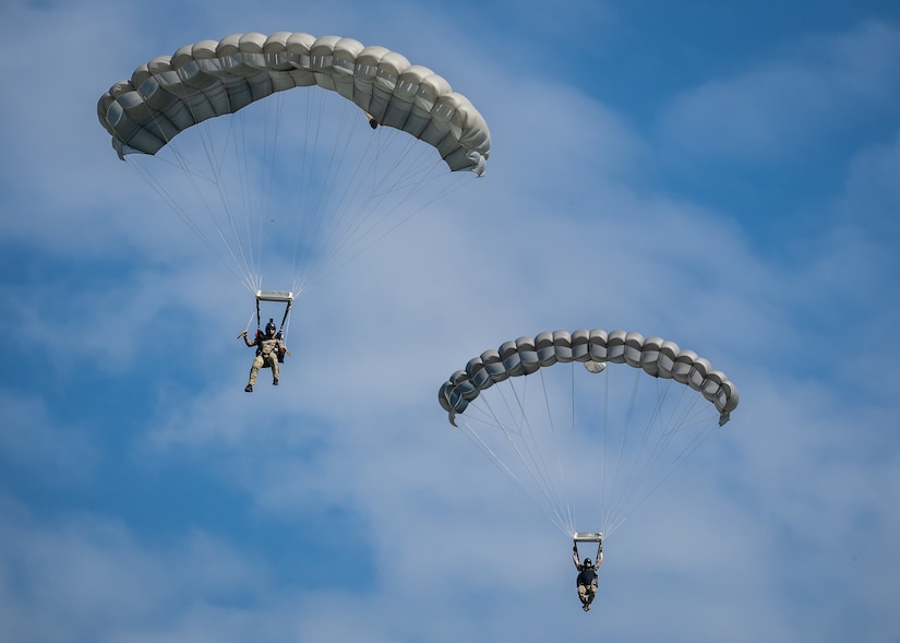 U.S. Air Force pararescuemen execute precision parachute landings at Freeman Municipal Airport in Seymour, Ind., Sept. 4, 2023, as part of the PJ Rodeo. The biennial event, which tests the capabilities of pararescue Airmen across the service, was hosted by the Kentucky Air National Guard’s 123rd Special Tactics Squadron. (U.S. Air National Guard photo by Dale Greer)
