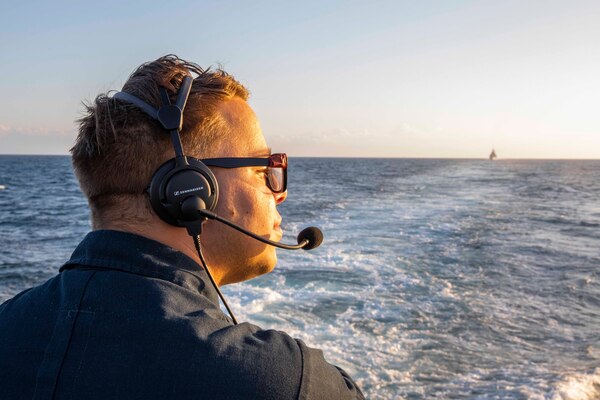 Boatswain’s Mate 3rd Class George Wilson, from Bolivar, Missouri, stands watch on the flight deck aboard the Arleigh Burke-class guided-missile destroyer USS Ralph Johnson (DDG 114) while conducting routine underway operations. Ralph Johnson is forward-deployed to the U.S. 7th Fleet area of operations in support of a free and open Indo-Pacific.