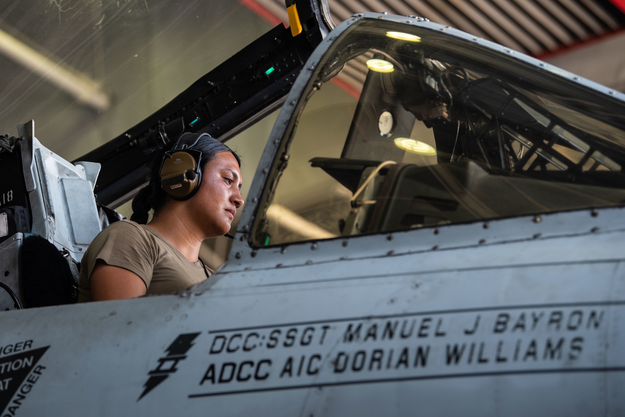 A photo of an Airman in the cockpit of an A-10C Thunderbolt II