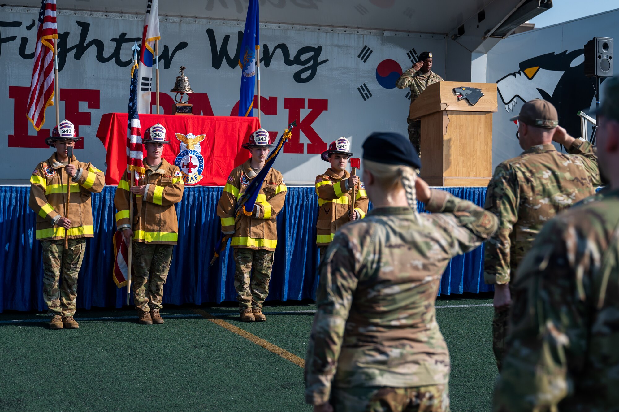 8th Civil Engineer Squadron firefighters present the colors during a 9/11 remembrance ceremony.