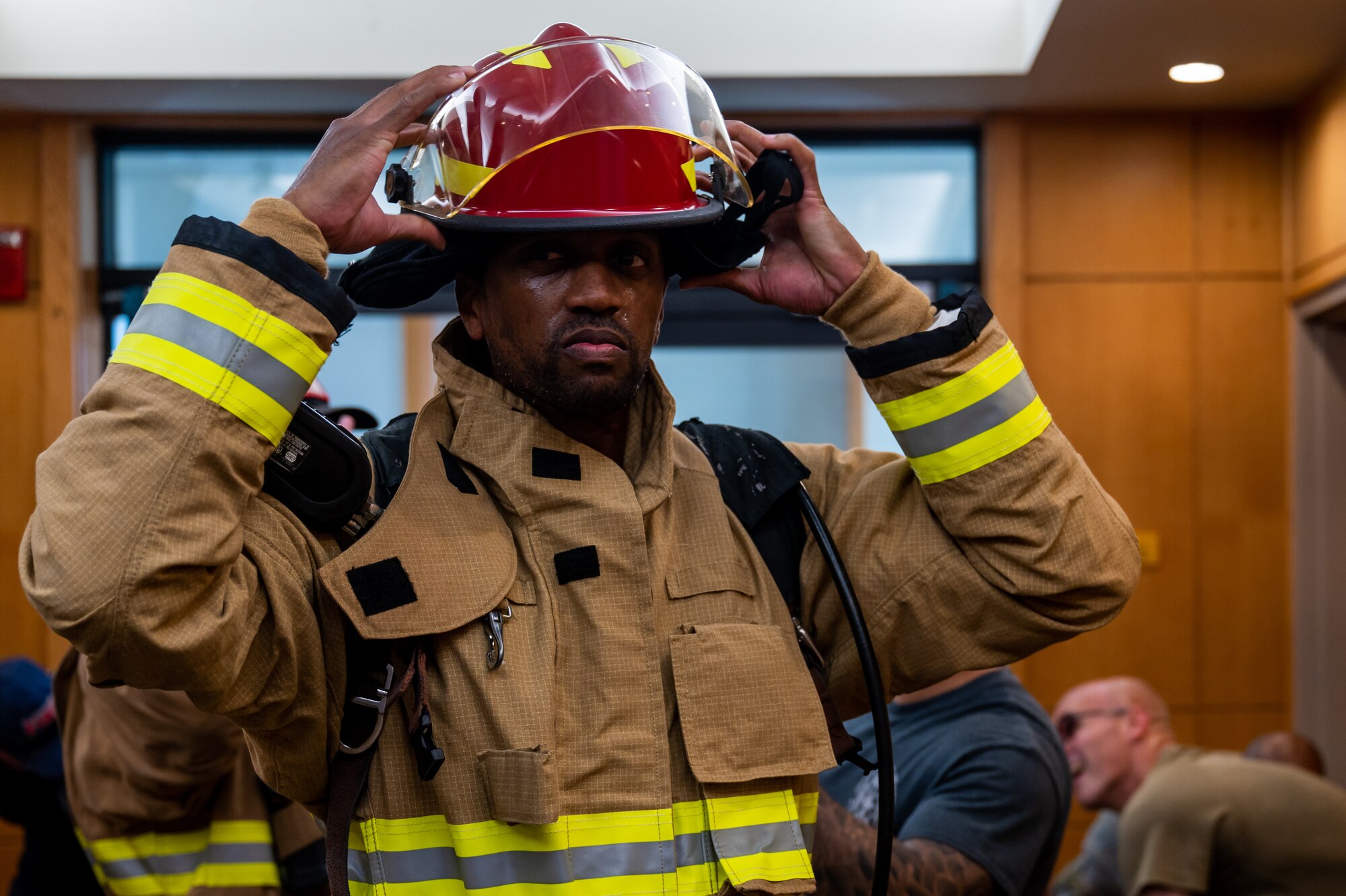 Tech. Sgt. Christopher Morgan dons his helmet in preparation for the 9/11 remembrance stair climb.