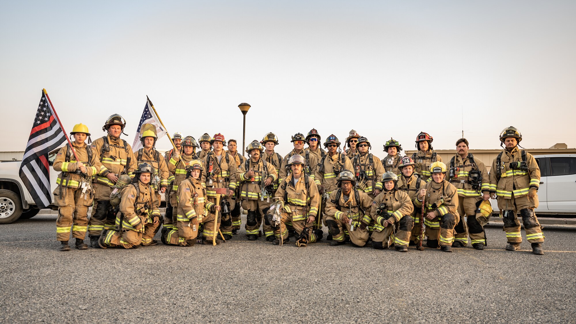 U.S. Air Force fire protection Airmen from the 386th Expeditionary Civil Engineer Squadron gather before a 9/11 memorial ruck march at Ali Al Salem Air Base, Kuwait, Sept. 11, 2023. Service members from the U.S., Canada, Italy, and Denmark gathered together today for a moment of silence followed by a ruck march in remembrance of the innocent lives lost during the attacks on this fateful day 22 years ago. Sharing the past with our coalition partners secures a brighter future for us all. (U.S. Air Force photo by Staff Sgt. Kevin Long)