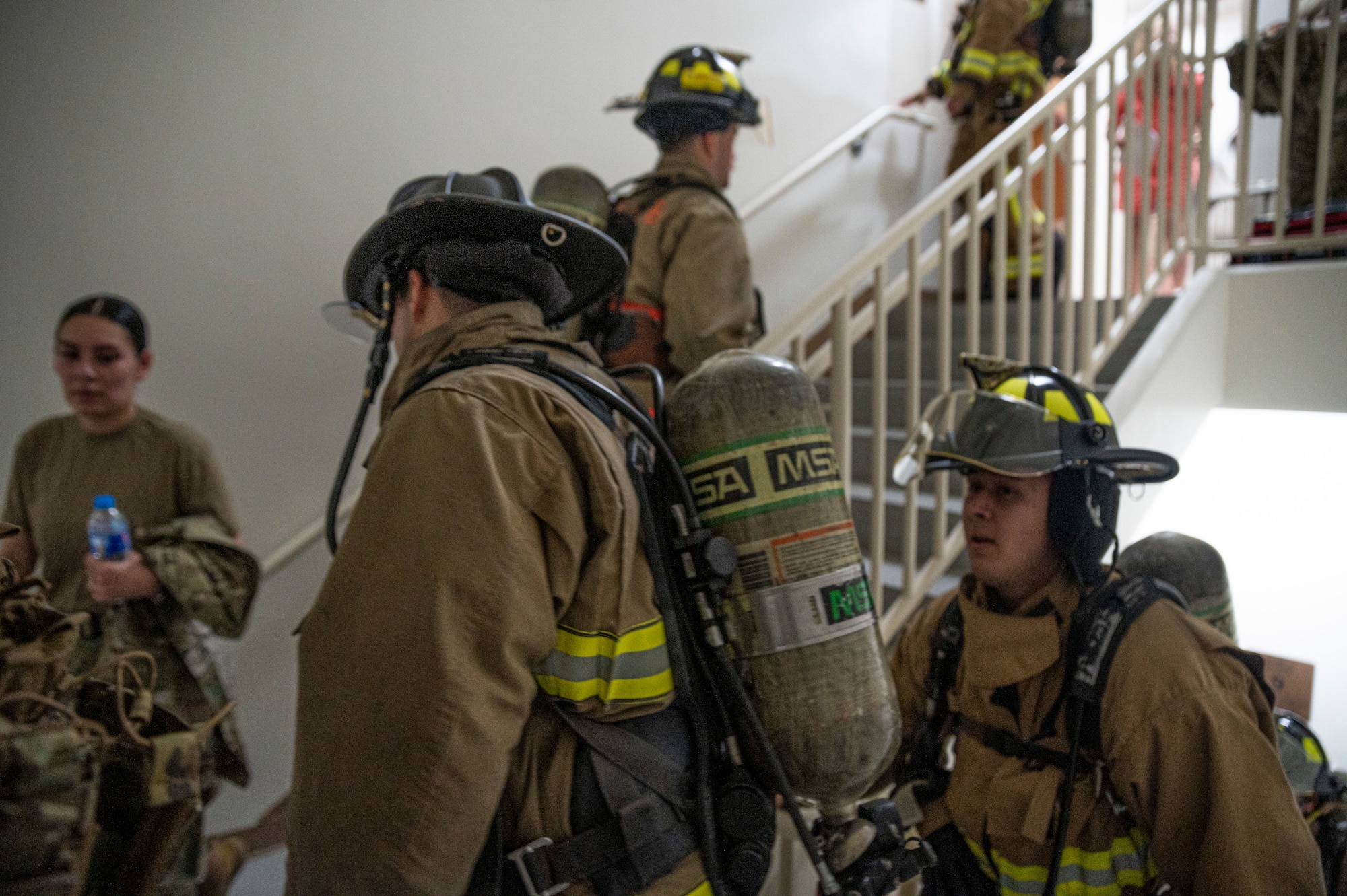 U.S. Air Force firefighters assigned to the 51st Civil Engineer Squadron climb stairs during a 9/11 memorial event at Osan Air Base, Republic of Korea, Sept. 11, 2023.