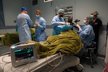 A team of military ophthalmologists discuss surgical approach of manual small incision cataract surgery during a training mission to Regional Hospital Dr. Luis "Chicho" Fabrega in Santiago de Veraguas, Panama, as part of a three-week mission that occurred on July 17, 2023.