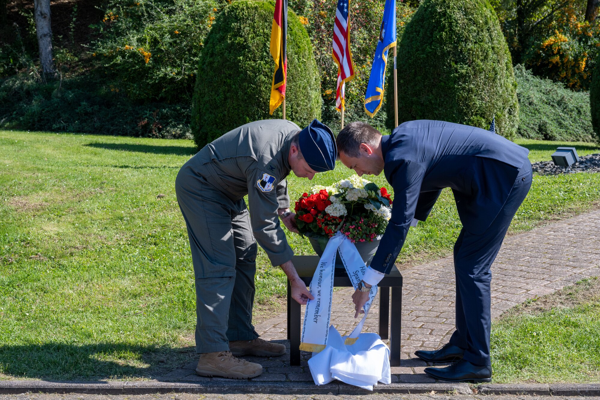 U.S. Air Force Col. Kevin Crofton, 52nd Fighter Wing commander, and Herr Manuel Follmann, area mayor of Wittlich-Land, Germany, lay a wreath during a 9/11 Remembrance ceremony