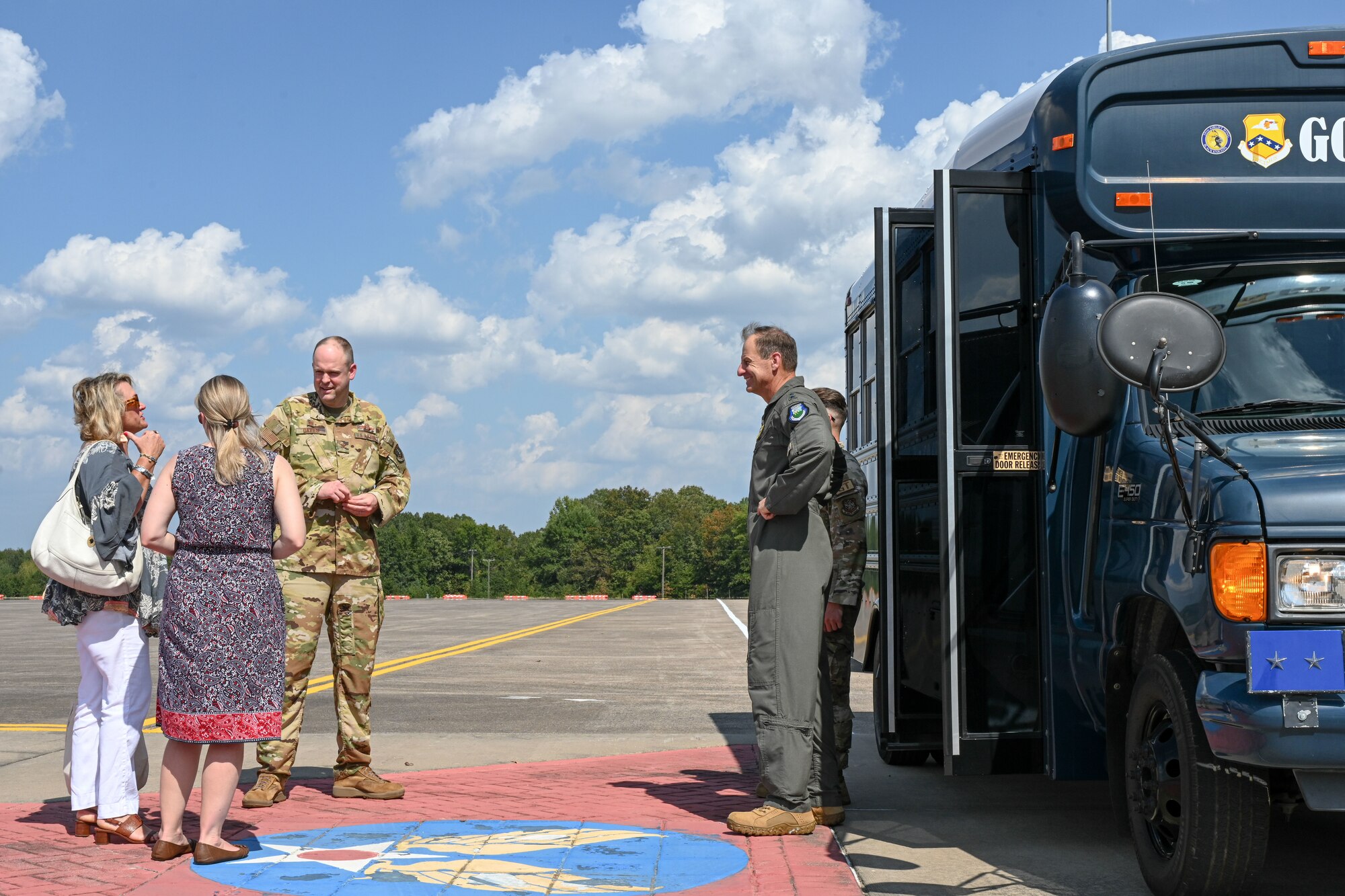 a man and woman is greeted and welcomed on base