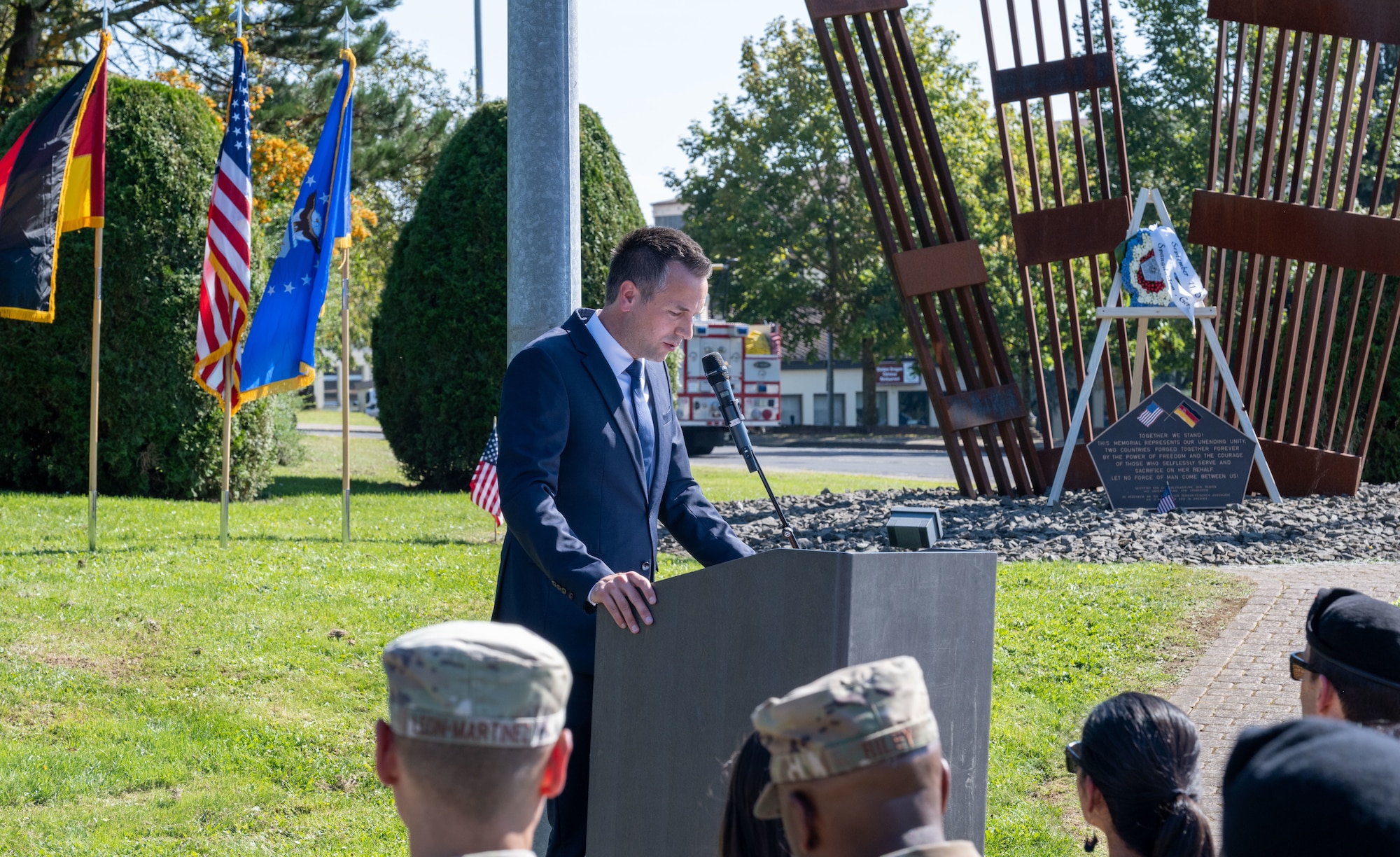 Herr Manuel Follmann, area mayor of Wittlich-Land, Germany, gives remarks during a 9/11 Remembrance ceremony,