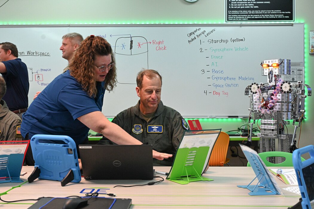 man in uniform receives brief about STARBASE program