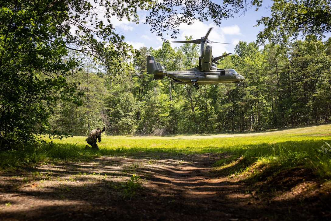 U.S. Marines from 4th Civil Affairs Group (4th CAG), Marine Corps Advisor Company-A (MCAC-A), and 4th Air Naval Gunfire Liaison Company (4th ANGLICO) conduct an air insert during a simulated community relations exercise while participating in Military Operations on Urban Terrain on Marine Corps Base Quantico, Virginia, June 13, 2023. This wargame event focused on Naval Engagement concepts with the goal of building and maintaining regional maritime access and influence at echelon across the phases of competition, crisis, and conflict. The wargame was the initial training event within the larger Force Headquarters Groups, Marine Forces Reserve, Naval Engagement Exercise 23 (NEX 23) intended to increase combat readiness and validate the Naval Engagement Concept in support of Force Design. (U.S. Marine Corps photo by Lance Cpl. Joaquin Dela Torre)