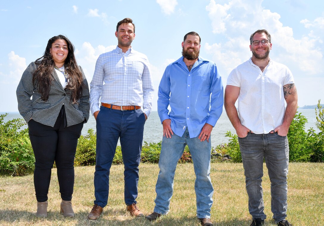 IMAGE: The Naval Surface Warfare Center Dahlgren Division MK38 MOD4 Gun Weapon Systems Console Design and Integration Team, consisting of team members (pictured left to right) Christie Cons, Ryan Cervino, Joshua Assur and John Holder with the Integrated Engagement Department, was selected for the Fiscal Year 2023 Third Quarter Program Executive Office Integrated Warfare Systems Excellence Awards. Not pictured are James Carsola and Luke Delozier.