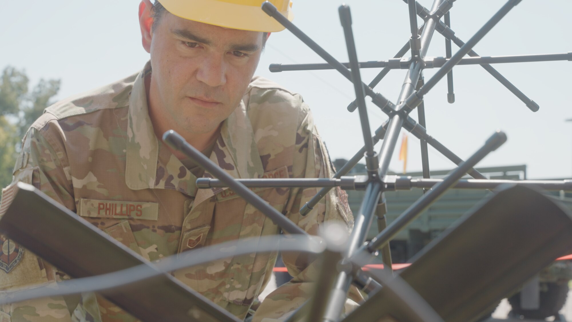 Staff Sgt. Nathaniel Phillips, a cyber systems operator for the 226th Communications, inspects a satellite during Exercise Copperhead Beacon 23 at the group’s headquarters in Montgomery, Alabama, on September 8, 2023.