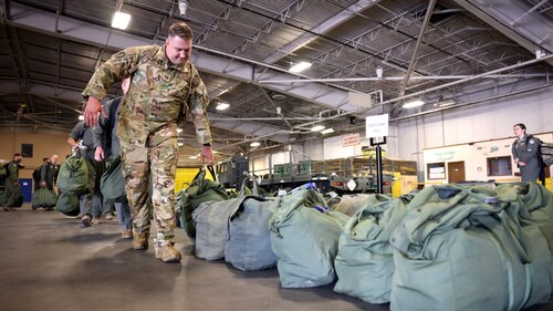 airmen dropping off bag