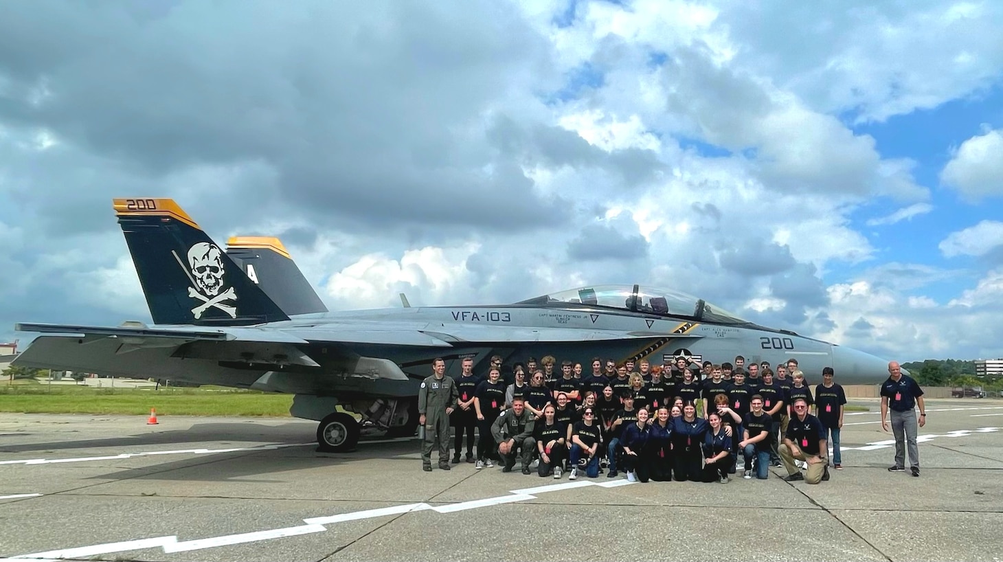 PITTSBURGH, Pa. (Sept. 10, 2023)- Sailors from the "Jolly Rogers" of Strike Fighter Squadron (VFA) 103 pose with U.S. Air Force Junior ROTC cadets from Plum High School in Plum, Pennsylvania. Cmdr. Jeffrey Creighan, commanding officer of VFA-103, attended Plum High School 24 years ago before joining the Navy. (Photo courtesy U.S. Navy)