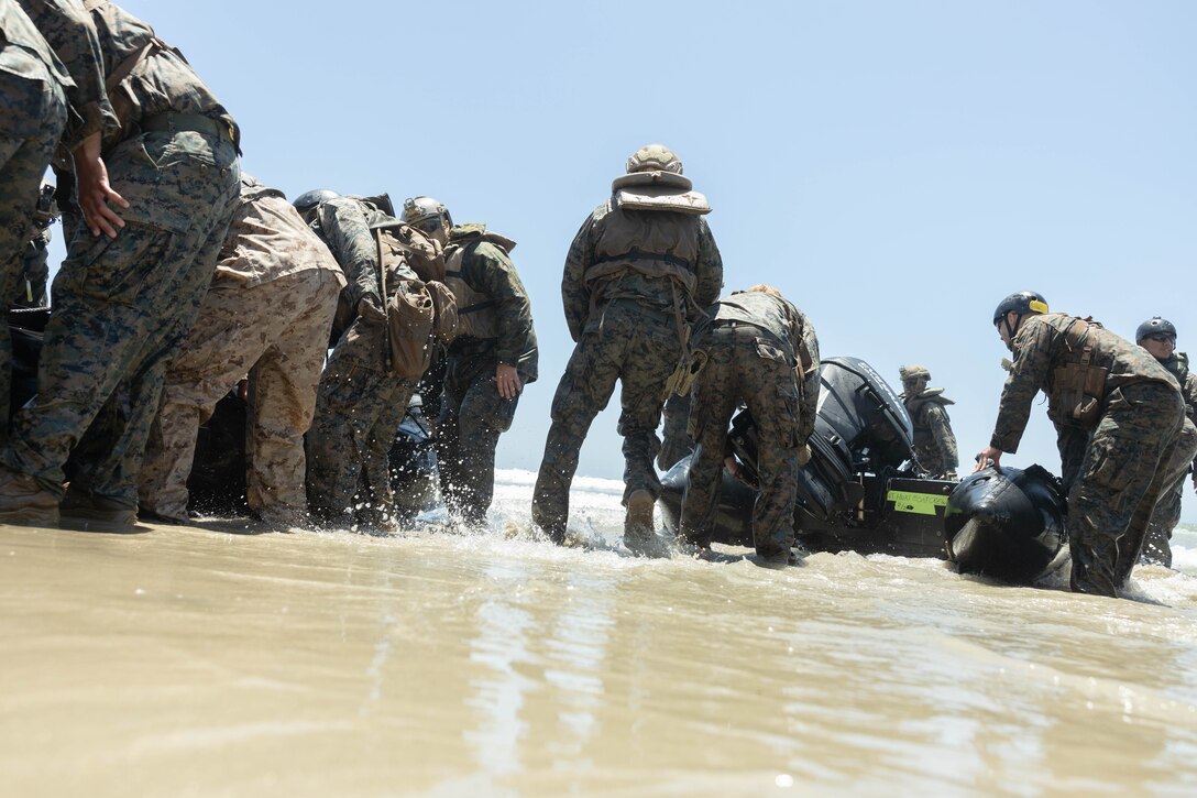 U.S. Marines with 1st Battalion, 1st Marine Regiment, 1st Marine Division, offload combat rubber reconnaissance craft during an amphibious raid course hosted by Expeditionary Operations Training Group, I Marine Expeditionary Force, at Marine Corps Base Camp Pendleton, California, June 21, 2023. The purpose of the amphibious raid course is to train raid force tactics, techniques, and procedures to enhance 1st Bn., 1st Marines’ capabilities in preparation for their deployment with the 31st Marine Expeditionary Unit.
