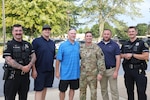 U.S. Army Lt. Col. Mark Martella, firefighter Keith Still, Officers Dylan Canada and Michael Tappen are presented with the Manheim Township Police Department’s Citation for Excellence for the life saving measures taken on June 1, 2023 providing CPR to an unconscious man in Lancaster, Pa. Aug. 28, 2023.