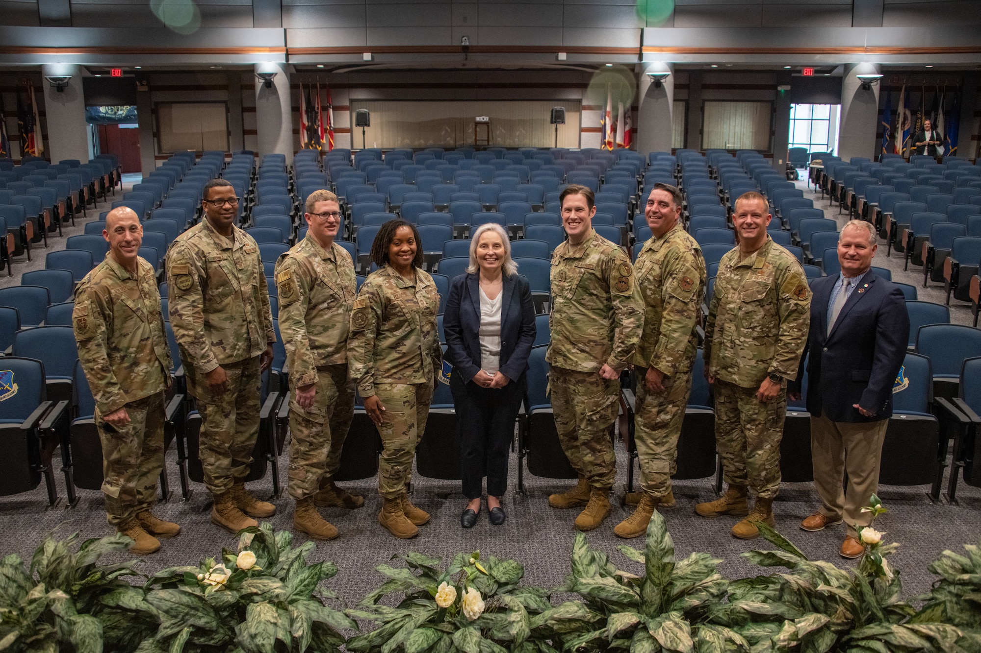 Crystal Moore, director of Force Development, Headquarters Air Force, stands for a photo in Kisling Hall with staff from the Thomas N. Barnes Center for Enlisted Education, Senior Noncommissioned Officer Academy and Chief Leadership Academy during an enlisted professional military education immersion at Maxwell Air Force Base, Gunter Annex, Ala., Sept. 7, 2023. (U.S. Air Force photo/Brian Ferguson)