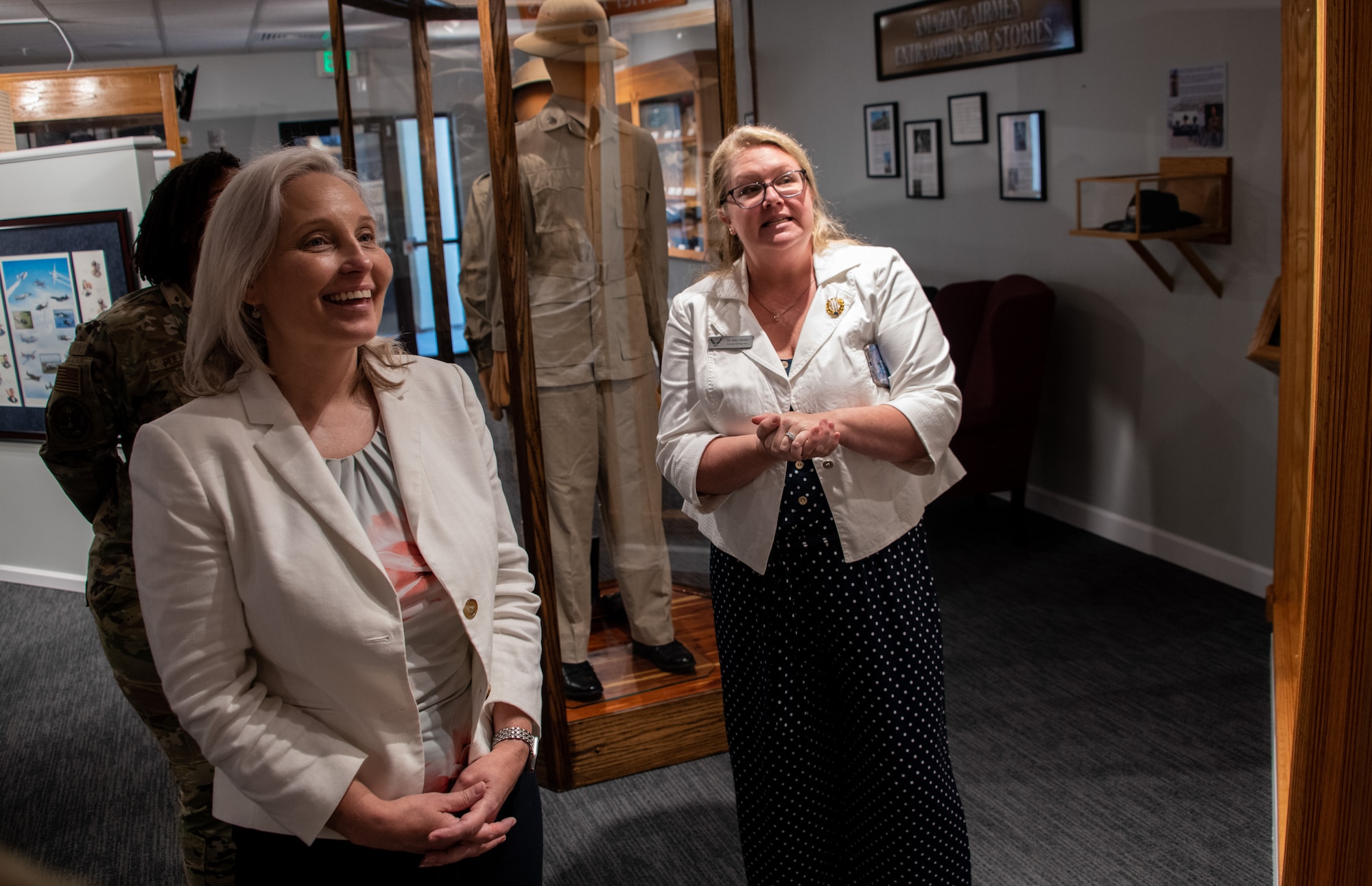 Crystal Moore, director of Force Development, Headquarters Air Force, receives a tour of the Enlisted Heritage Research Institute from Dr. Emily Shade, curator, during an enlisted professional military education immersion at Maxwell Air Force Base, Gunter Annex, Ala., Sept. 7, 2023. (U.S. Air Force photo/Brian Ferguson)