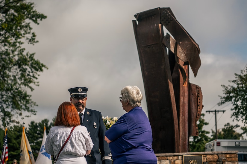 A photograph of a 9/11 memorial ceremony on JB MDL.