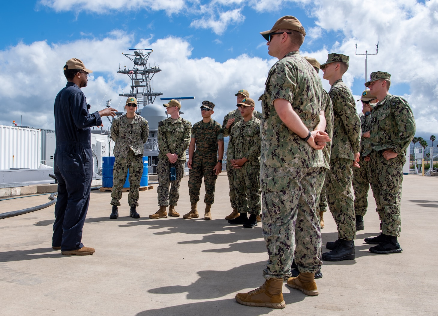Lt. Christopher Shaw (Left), from Plaquemine, Louisiana, communications officer assigned to Unmanned Surface Vessel Division One, explains to University of Hawaii Navy ROTC midshipmen the operational capabilities of the unmanned surface vessel Ranger during a tour of the ship on Joint Base Pearl Harbor-Hickam, Hawaii, Aug. 16, 2023. The midshipmen are participating in a Navy summer internship program at U.S. Pacific Fleet.