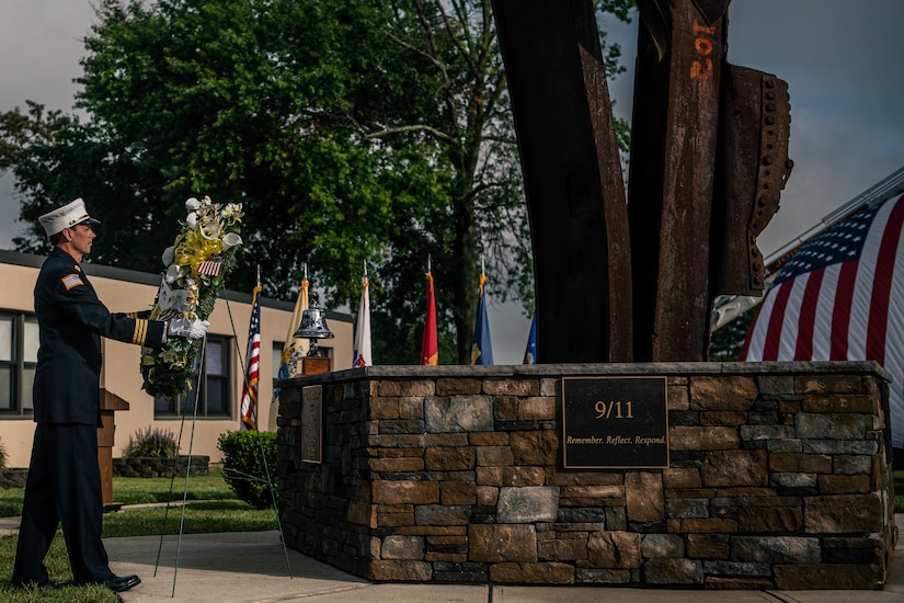 A photograph of a 9/11 memorial ceremony on JB MDL.
