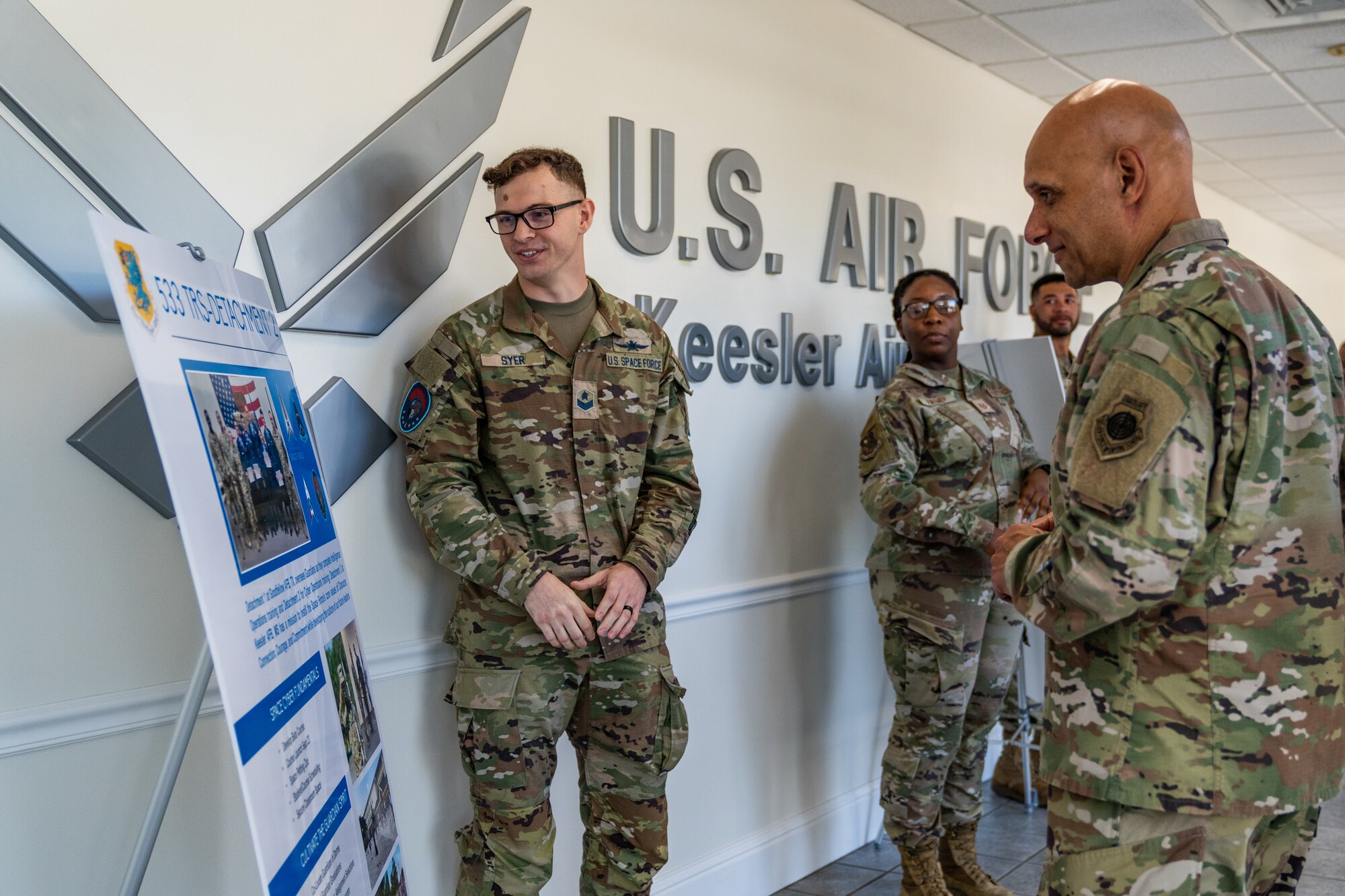 U.S. Space Force Sgt. George Syer, 533rd Training Squadron Detachment 2 member, briefs U.S. Air Force Lt. Gen. Brian Robinson, commander of Air Education and Training Command, on the Space Force’s role and the new detachment at Keesler Air Force Base