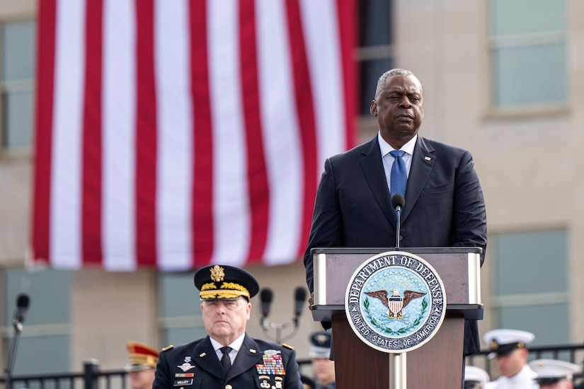 Defense Secretary Lloyd J. Austin III speaks from a stage.