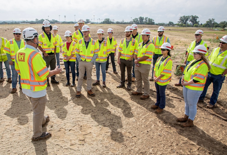 Summer interns wear personal protective equipment while visiting Offutt Air Force Base’s flood recovery project site on August 4, 2023.