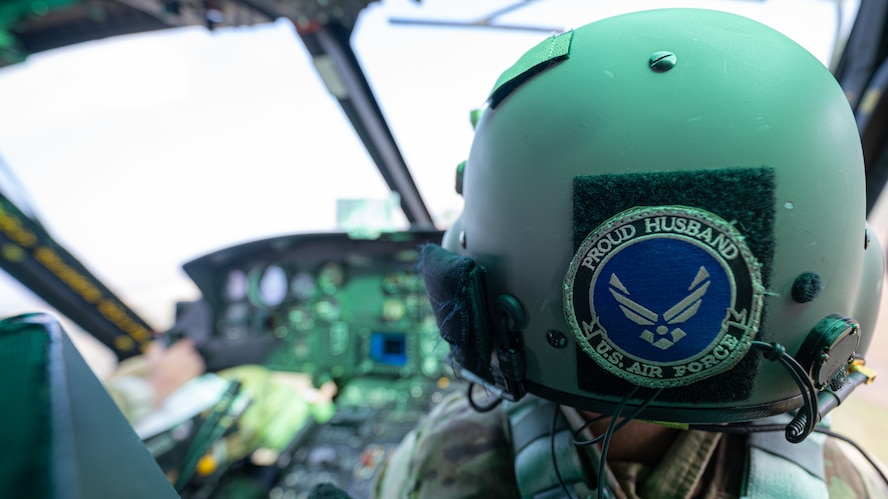 A 54th Helicopter Squadron (HS) UH-1N Iroquois pilot displays a “Proud Husband” patch on his helmet during a spouse orientation flight at Minot Air Force Base, North Dakota, Sept. 9, 2023. During the orientation flight spouses learned how the 54th HS contributes to the global deterrence mission. (U.S. Air Force photo by Airman 1st Class Alexander Nottingham)