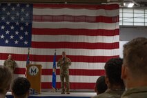 Chief Master Sgt. Donald Gallagher, Headquarters Air Force, takes the stage at the Patriot’s Day ceremony at Minot Air Force Base, North Dakota, Sept. 11, 2023. Gallagher spoke about the first responders who took action during the attacks on September 11th. (U.S. Air Force photo by Airman 1st Class Trust Tate)